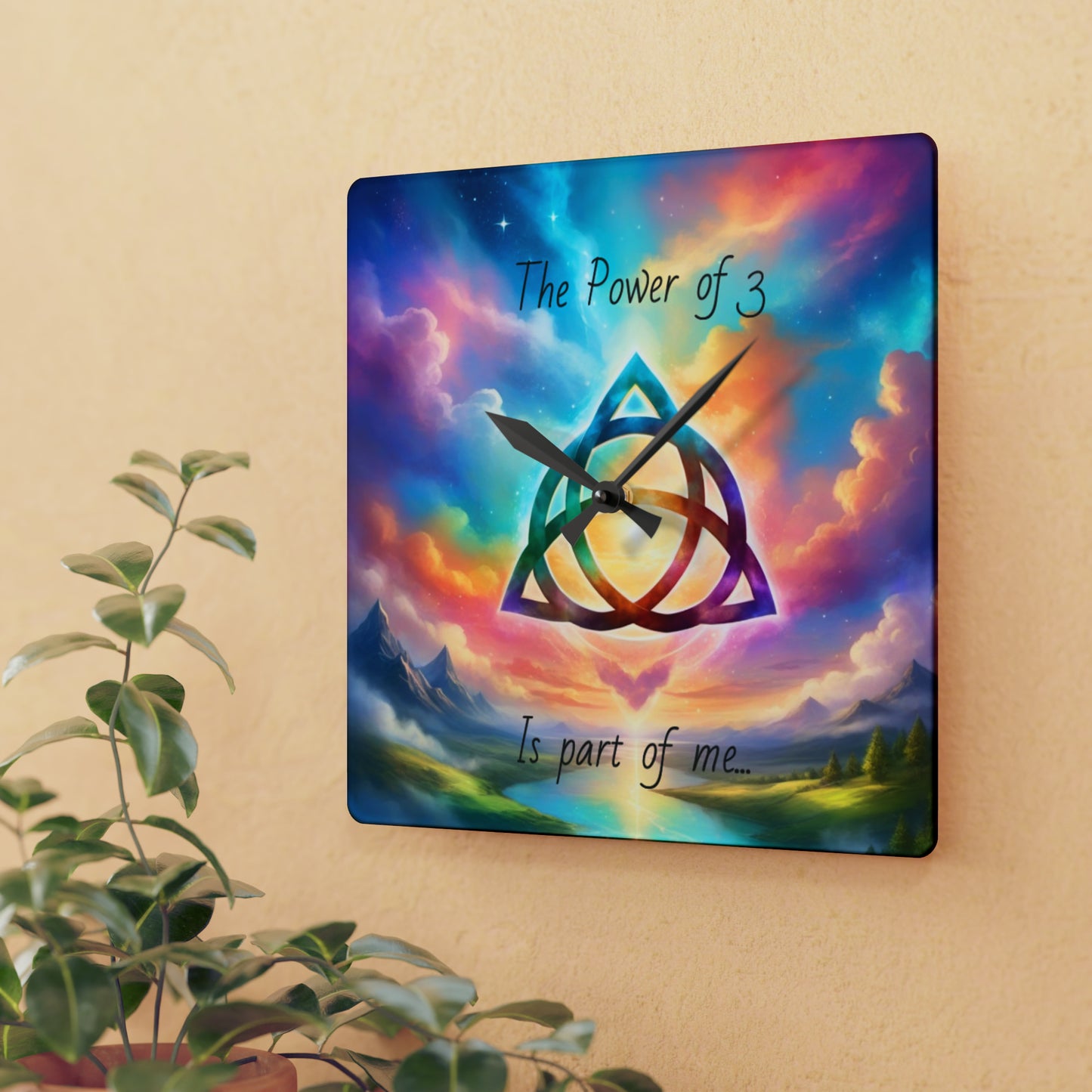 Acrylic Wall Clock, the power of 3 is part of me affirmation, brightly coloured sky with a triquetra symbol on it.