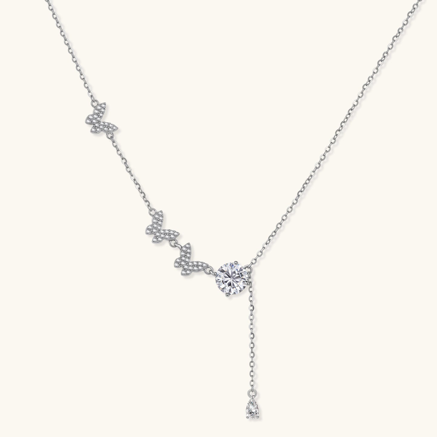Sterling silver Y-shaped necklace with butterfly charms and brilliant moissanite stone with teardrop pendant