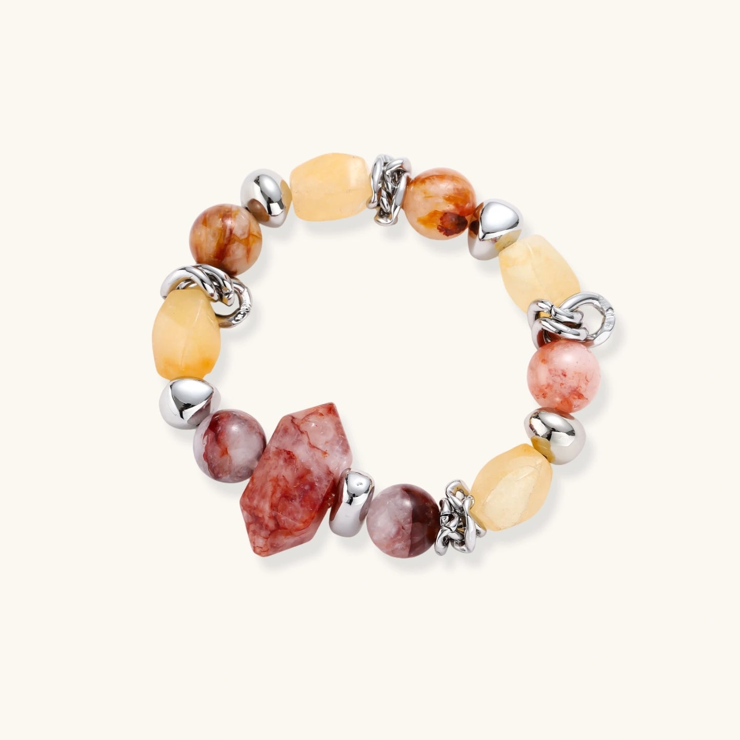 Stretch bracelet with amber citrine beads, red crystal stones and brass accents featuring a hexagonal centerpiece on white background.