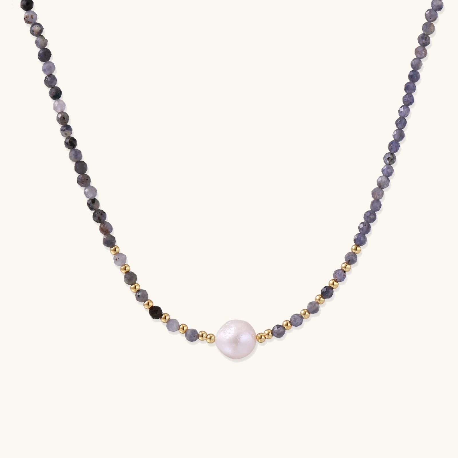 Dainty necklace with faceted purple iolite beads, gold vermeil accents, and central pink-white freshwater pearl.