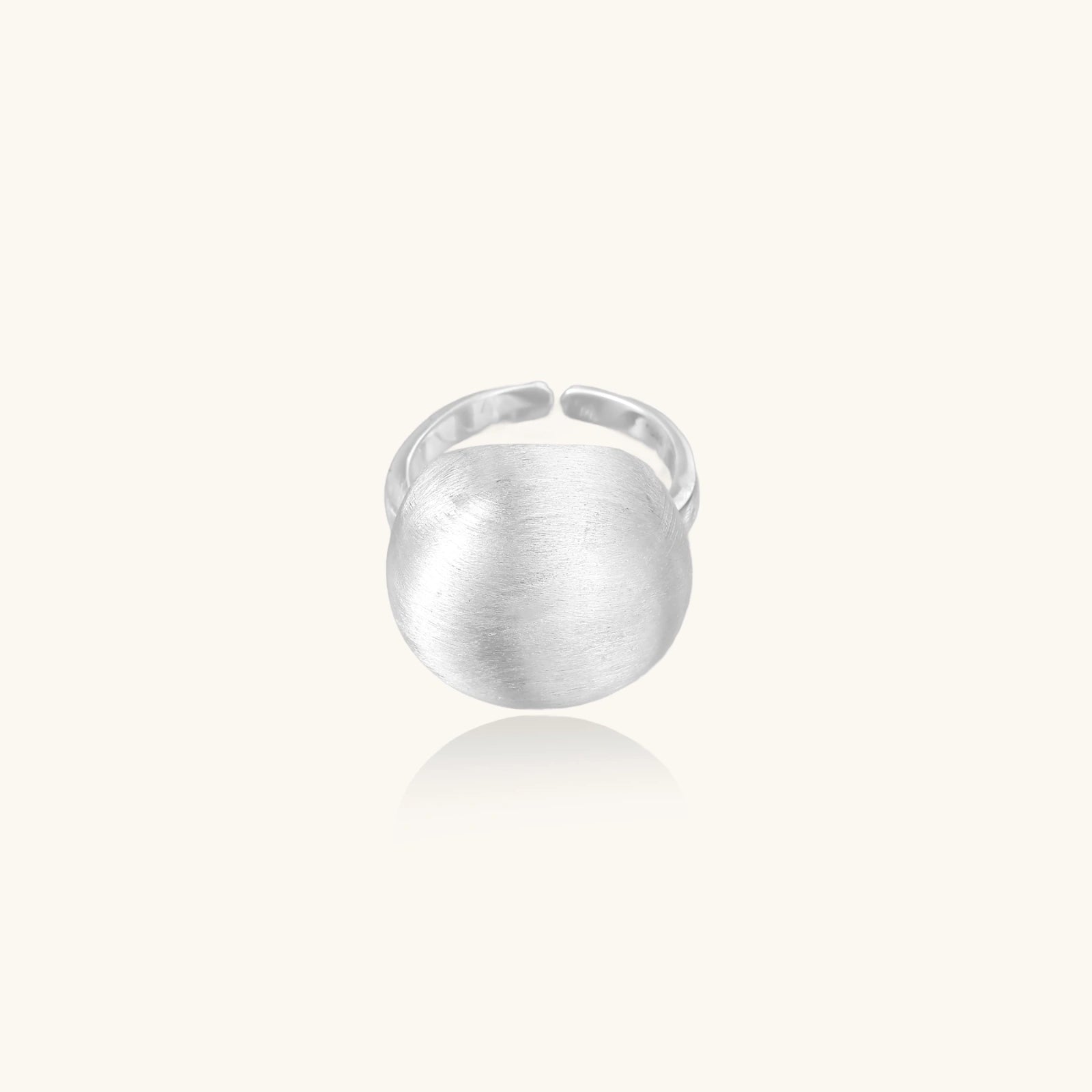 Minimalist brushed sterling silver dome ring with adjustable band on white background, front view.
