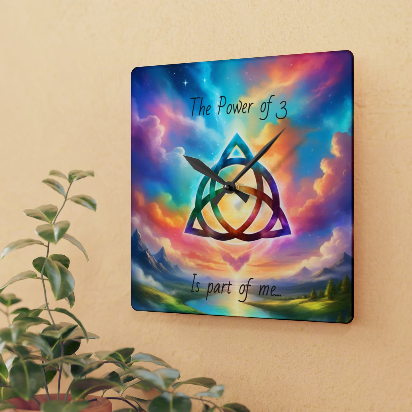 Acrylic Wall Clock, the power of 3 is part of me affirmation, brightly coloured sky with a triquetra symbol on it.