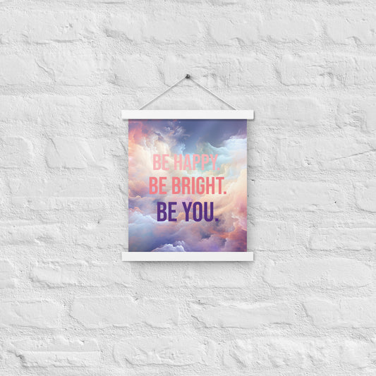 Poster with hangers, be bright, be happy, be you text on background of soft colorful clouds