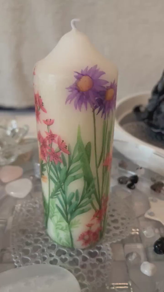 Pillar candle with floral, multiple flowers growing up from the bottom of the candle to the top , 50 hour burning