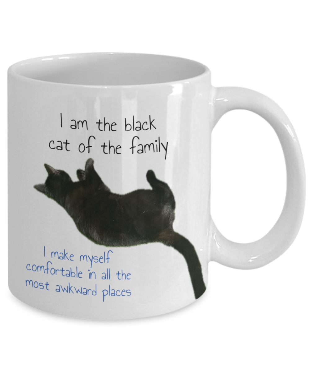 Black cat of the family, 11oz  or 15oz coffee mug, black cat love, black cat squatting, text and image on back of comfortable cat "I am the black cat of the family, I make myself comfortable in all the awkward places