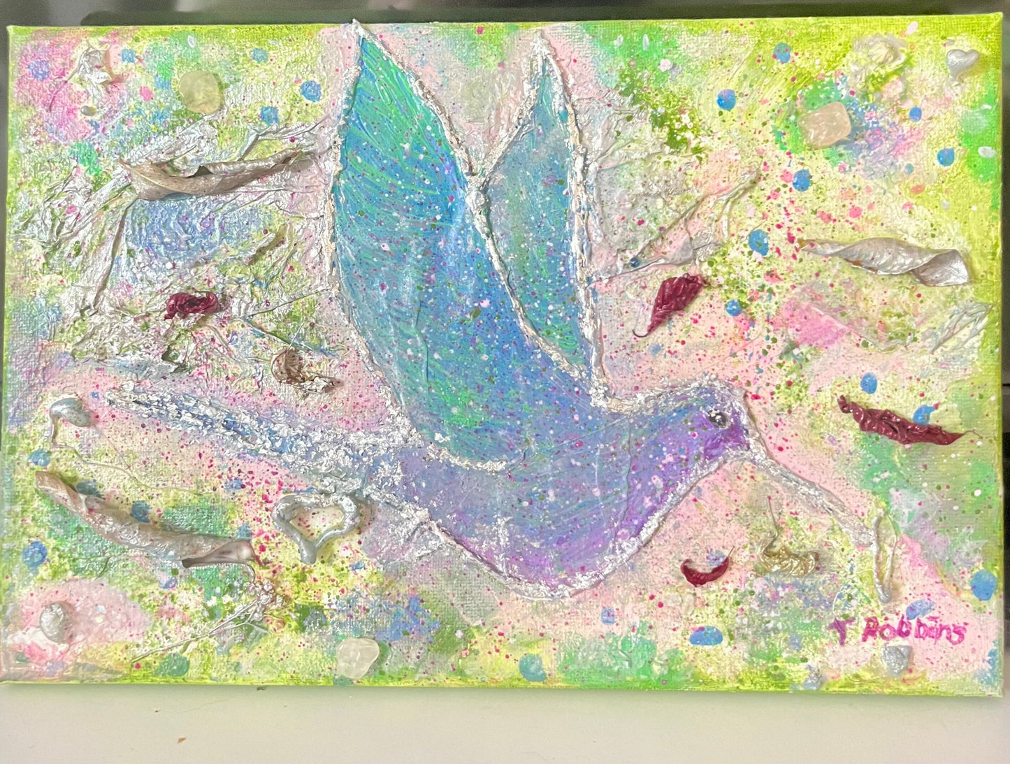 Hummingbird and poinsettia textured canvas containing light codes of love and joy.