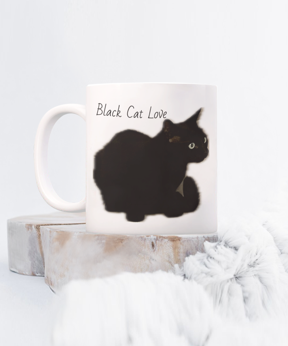 Black cat of the family, 11oz  or 15oz coffee mug, black cat love, black cat squatting, text and image on back of comfortable cat "I am the black cat of the family, I make myself comfortable in all the awkward places